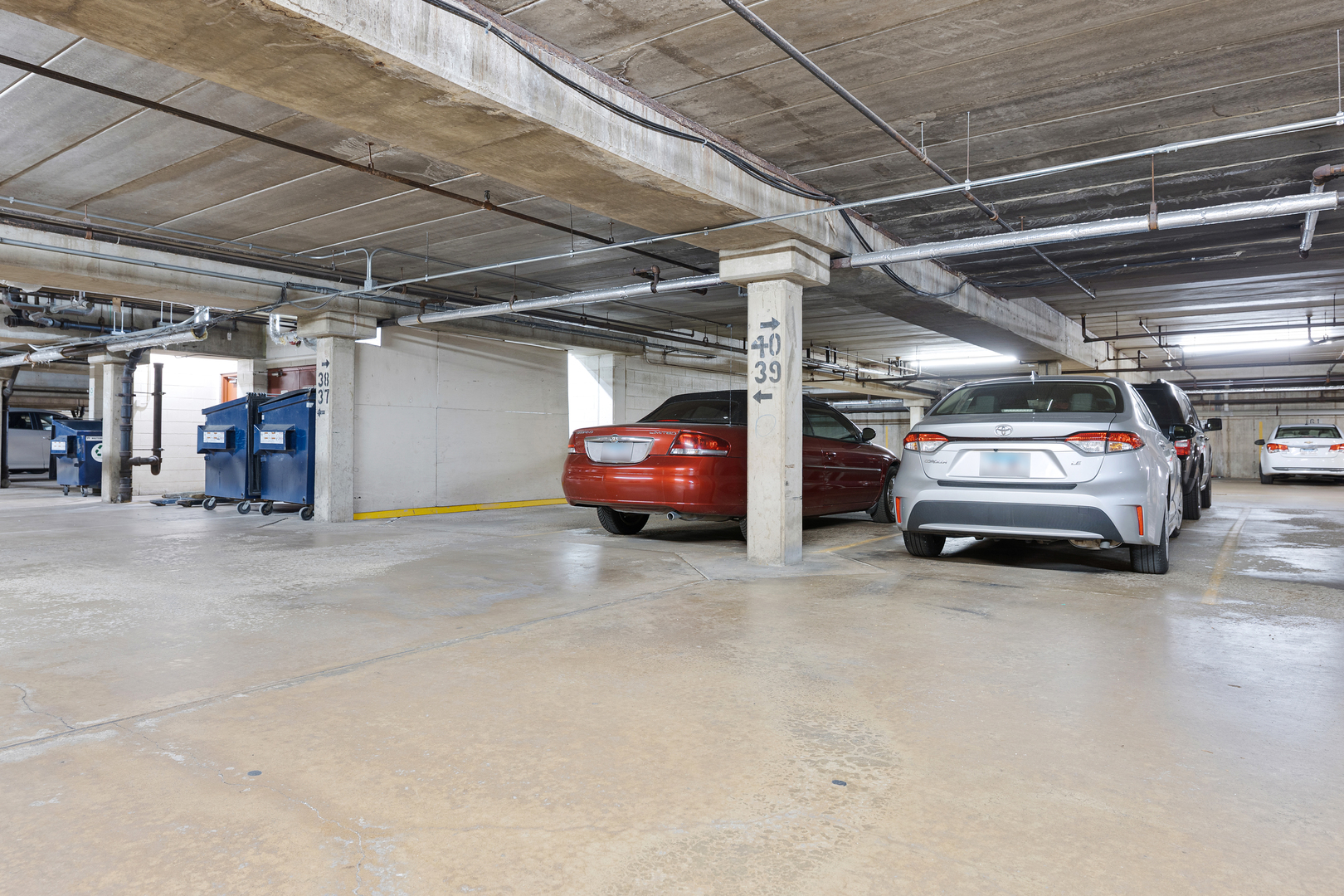 1912 Prairie Square, Unit 209A Schaumburg, IL 60173 - Photo 20 of 26 a view of parking garage with cars parked