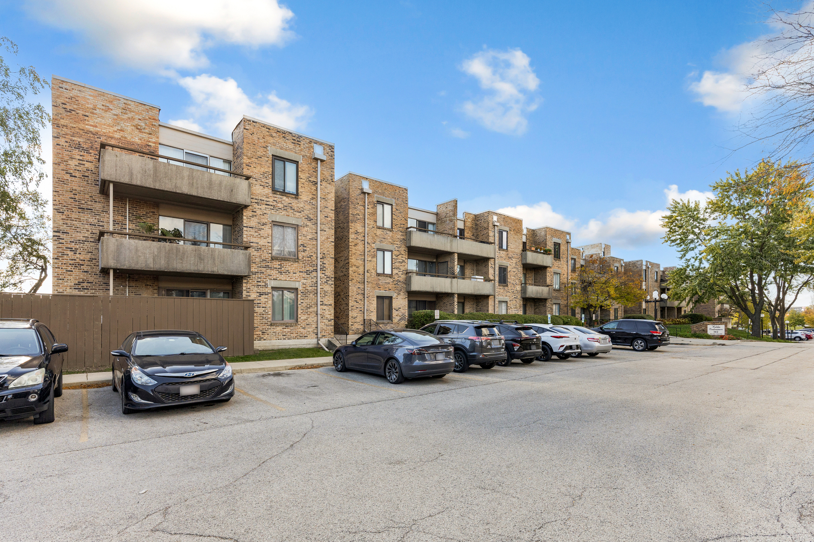 1912 Prairie Square, Unit 209A Schaumburg, IL 60173 - Photo 2 of 26 a car parked in front of a building