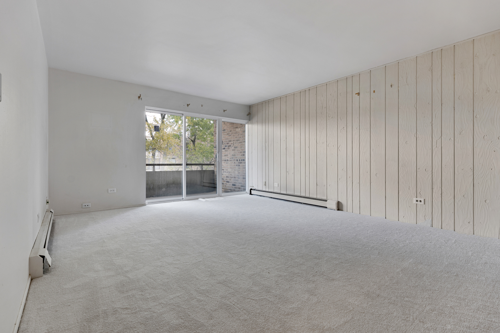 1912 Prairie Square, Unit 209A Schaumburg, IL 60173 - Photo 4 of 26 an empty room with windows