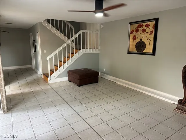 a view of entryway with stairs and wooden floor
