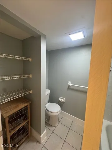 a bathroom with a toilet and a vanity
