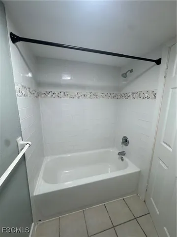 a white bath tub sitting in a bathroom