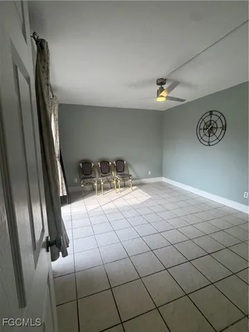 a bathroom with a sink and glass door