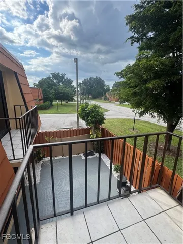 a balcony with wooden floor