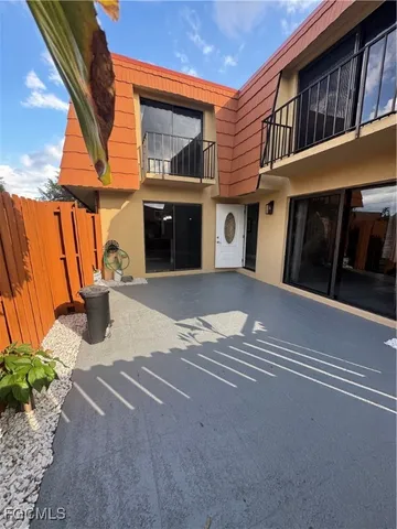 a view of a balcony with yard