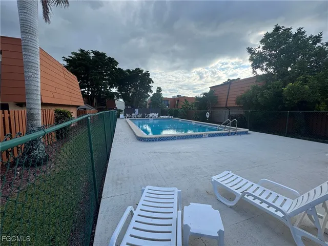 a view of balcony with wooden floor and outdoor seating