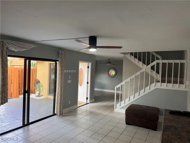 a view of entryway and hall with a front door