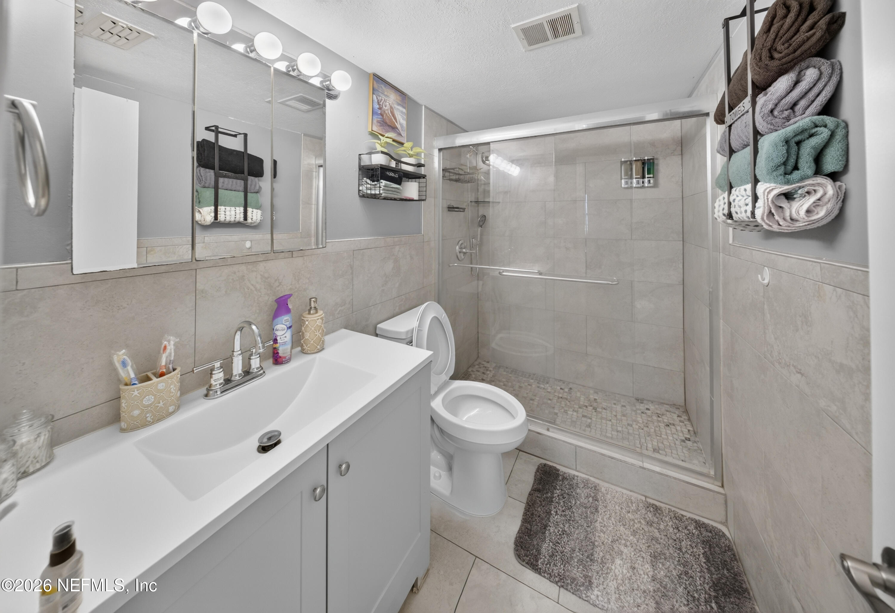 7346 El Barco Road, Unit 4 Jacksonville, FL 32216 - Photo 11 of 19 a bathroom with a sink toilet and shower