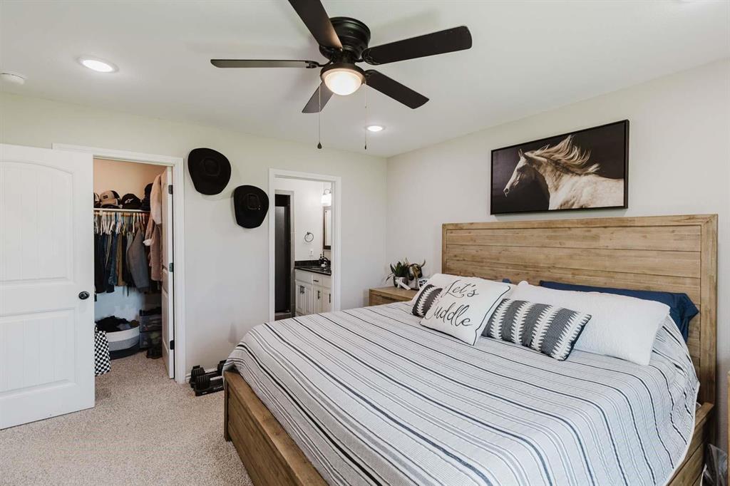 8615 North Fm 51 Decatur, TX 76234 - Photo 17 of 26 a bedroom with a bed and ceiling fan