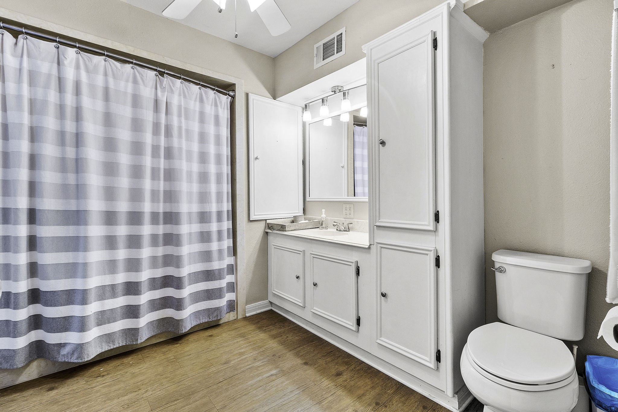 536 Weavers Cove Road Livingston, TX 77351 - Photo 8 of 44 a bathroom with a granite countertop sink toilet and shower