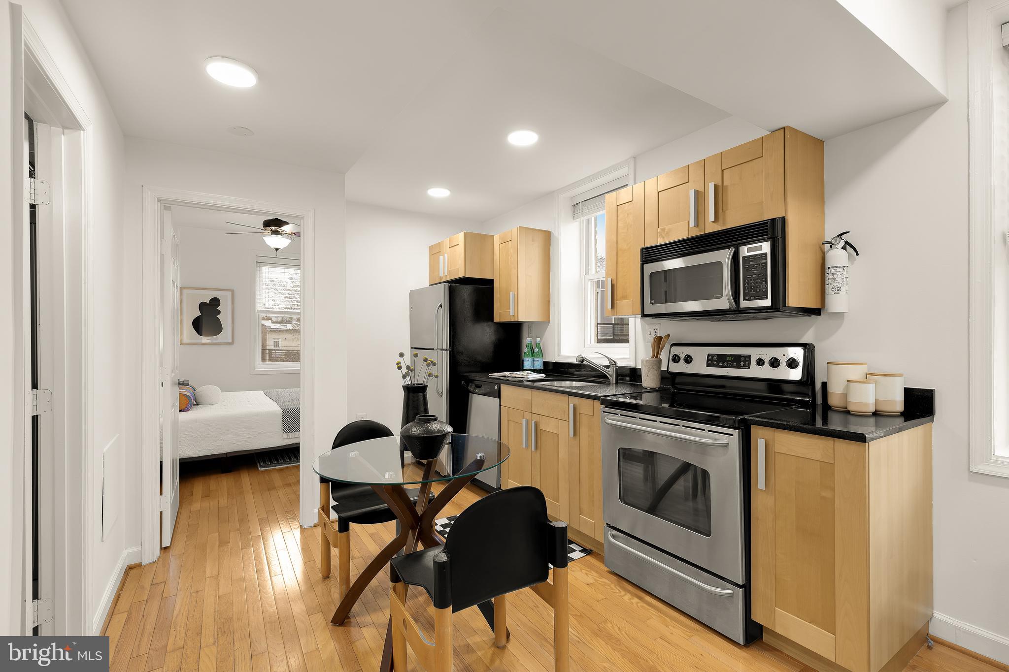 314 V Street Northeast, Unit 204 Washington, DC 20002 - Photo 5 of 13 a view of kitchen with sink stainless steel appliances and cabinets