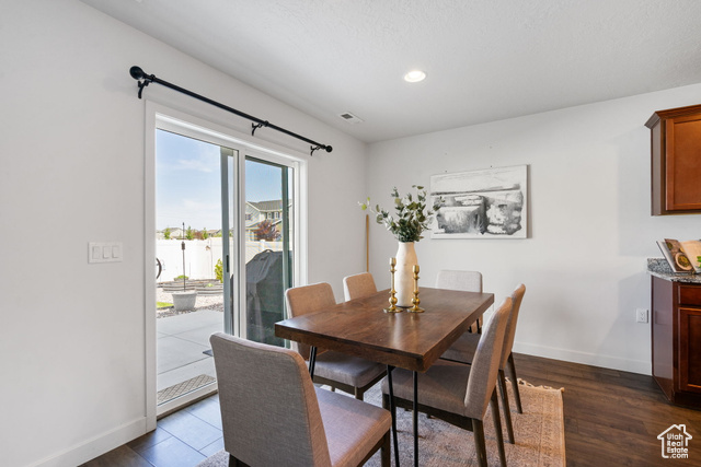 3456 South Linden Way Syracuse, UT 84075 - Photo 11 of 50 Dining room featuring dark wood finished floors, baseboards, and recessed lighting
