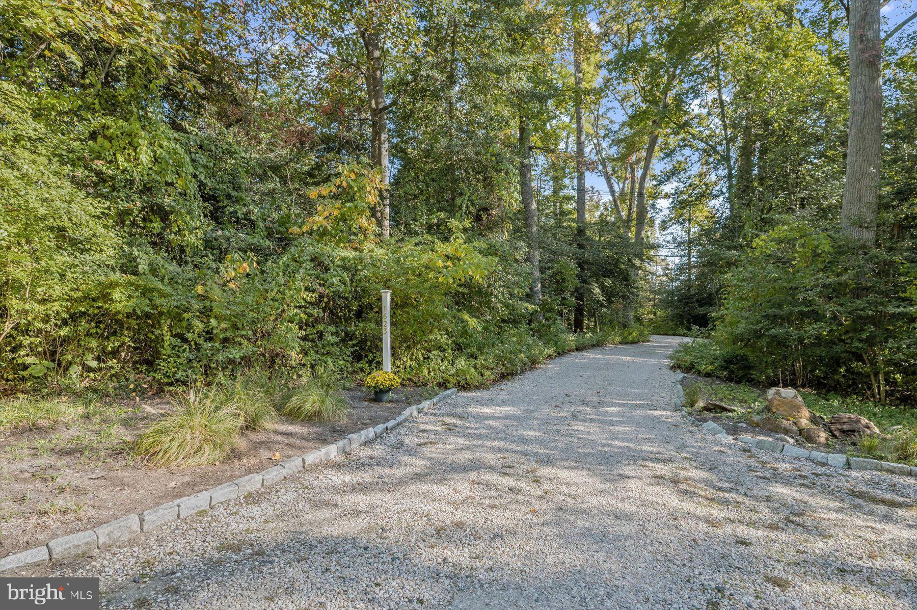 Winding Gravel Driveway Leads to House