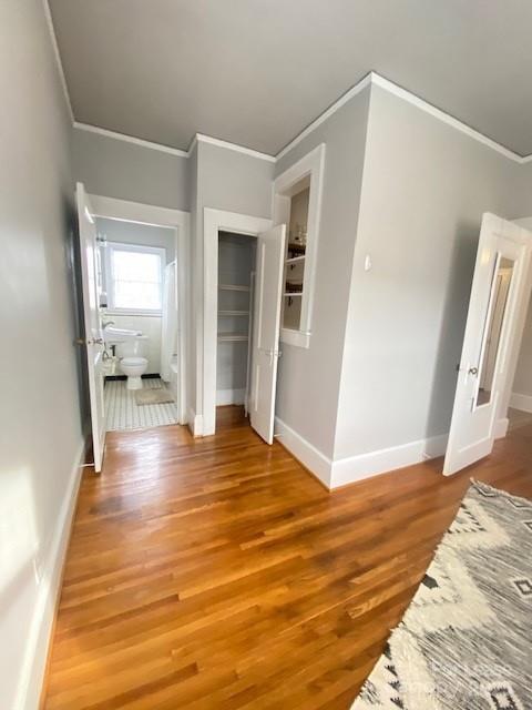 823 Central Avenue, Unit 1 Charlotte, NC 28204 - Photo 11 of 17 a view of an empty room with wooden floor and a window