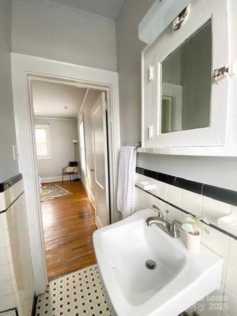 823 Central Avenue, Unit 1 Charlotte, NC 28204 - Photo 15 of 17 a bathroom with a sink and a mirror