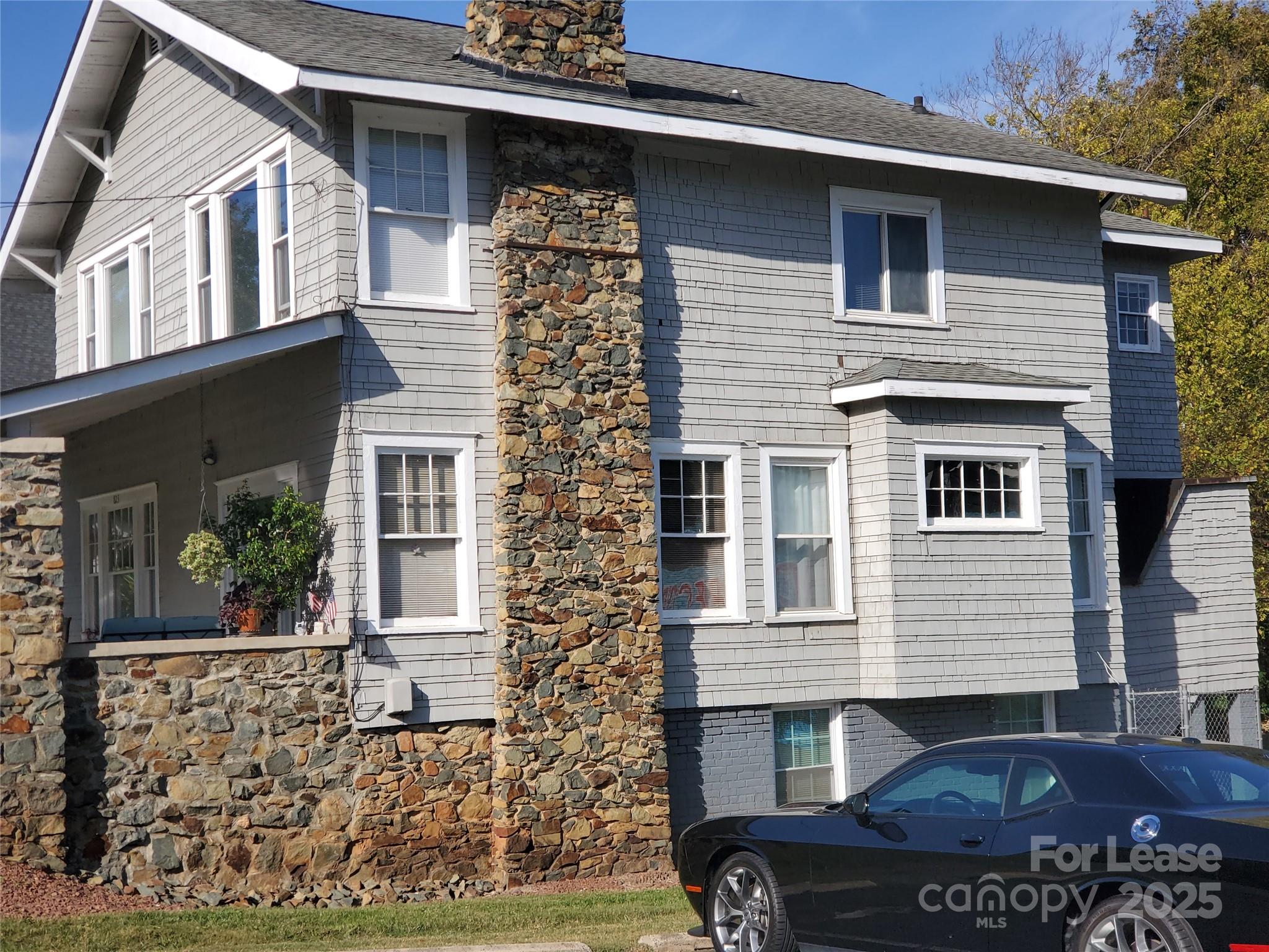 823 Central Avenue, Unit 1 Charlotte, NC 28204 - Photo 16 of 17 a front view of a house with a yard