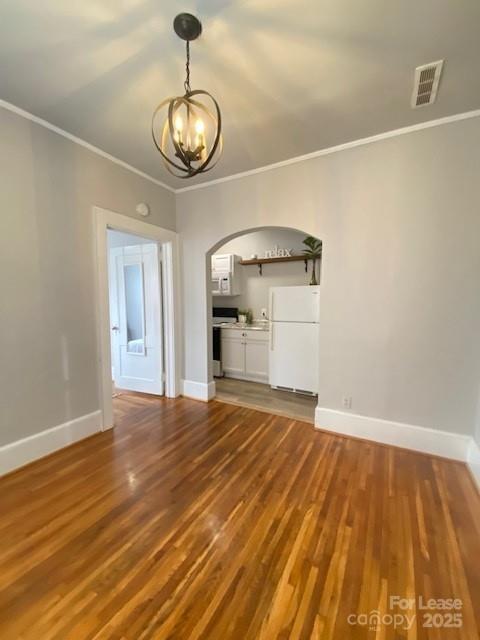 823 Central Avenue, Unit 1 Charlotte, NC 28204 - Photo 4 of 17 a view of empty room with wooden floor and fan