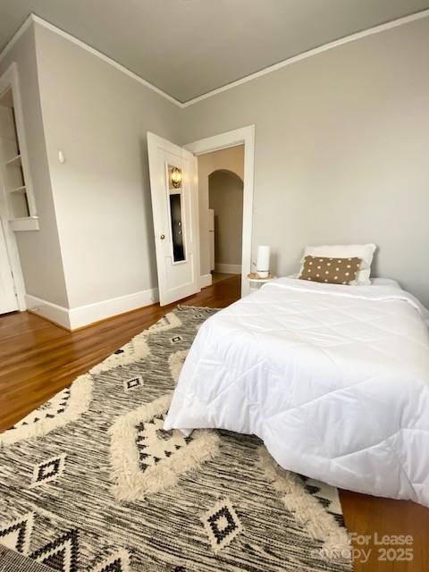 823 Central Avenue, Unit 1 Charlotte, NC 28204 - Photo 10 of 17 a bedroom with a bed and a rug