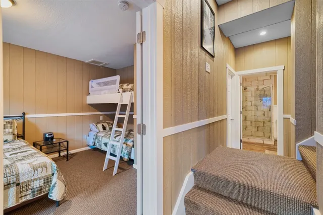 a bed room with a bed and a window