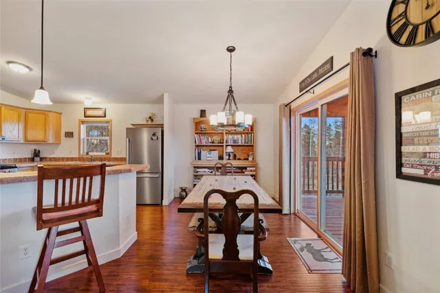 a view of a livingroom with furniture wooden floor and windows