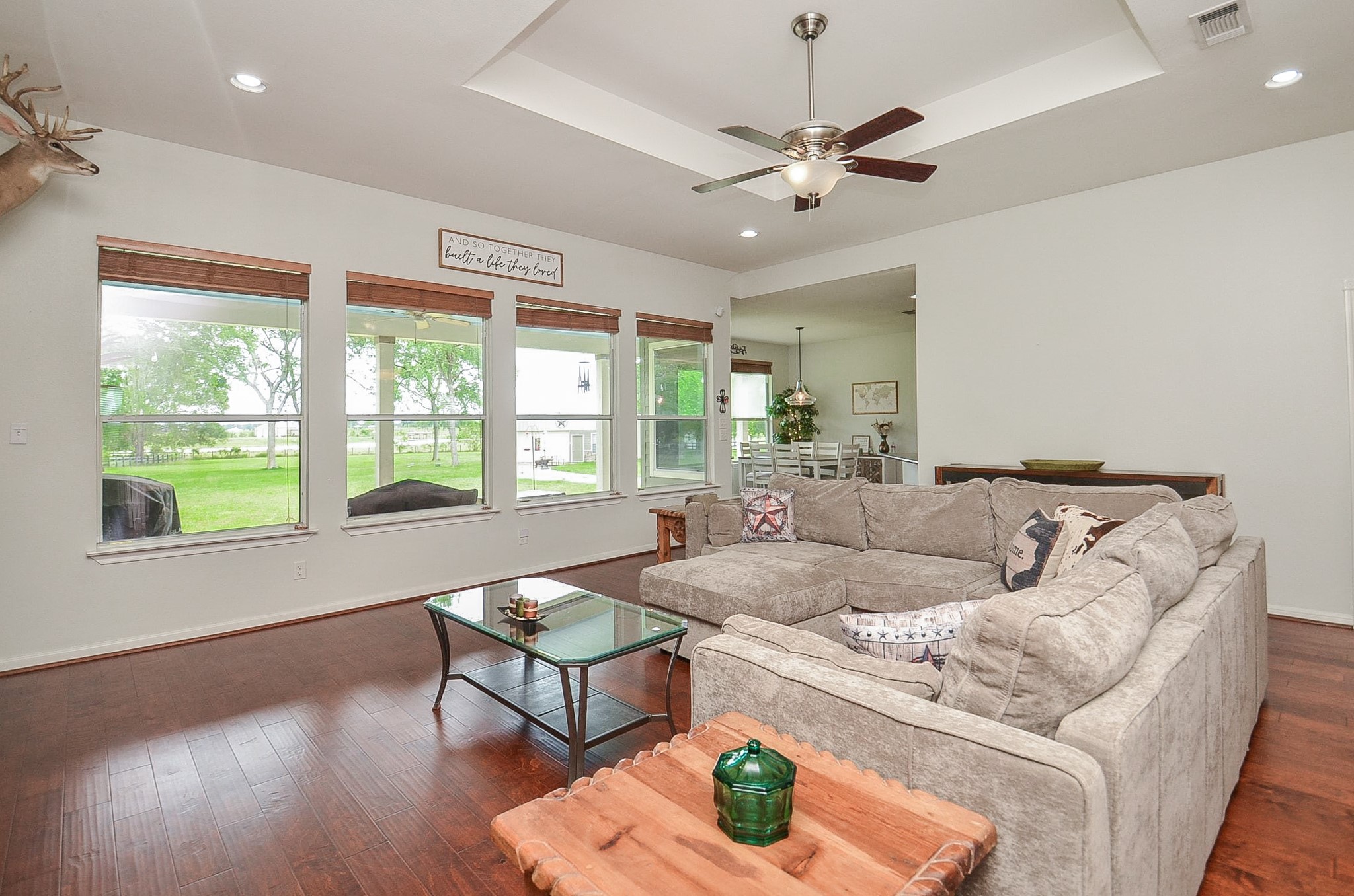 27644 Spring Hill Road Hempstead, TX 77445 - Photo 9 of 50 Invite green nature inside, in this view of a wall of huge windows overlooking patio and back yard from your stunning living area.