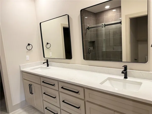 a bathroom with a sink and mirror