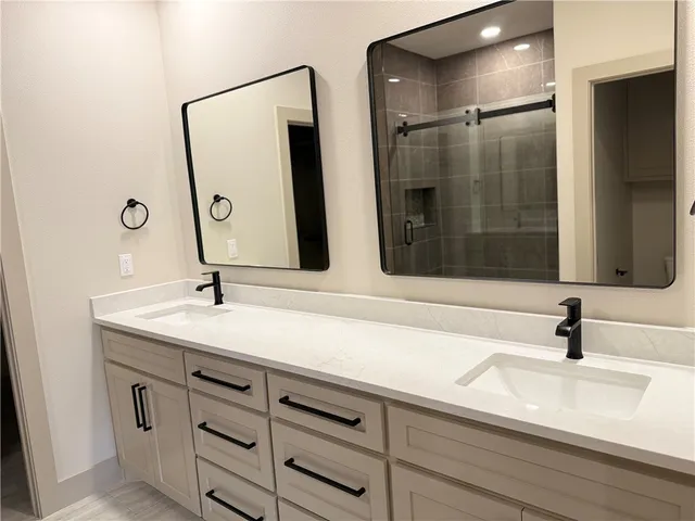 a bathroom with a sink and mirror