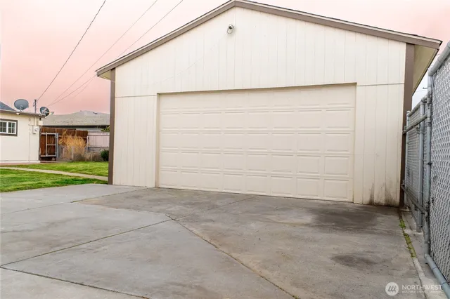 a view of a house next to a yard