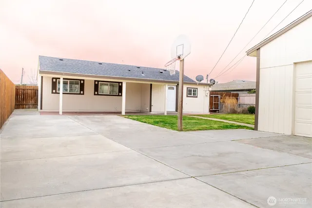 a living room with furniture rug and window