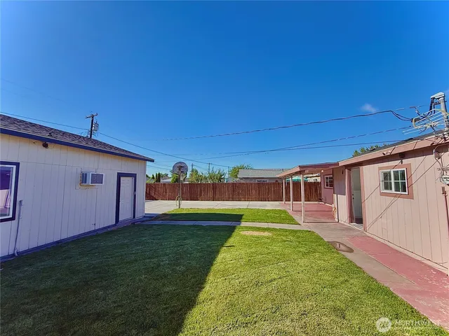 a swimming pool with wooden fence