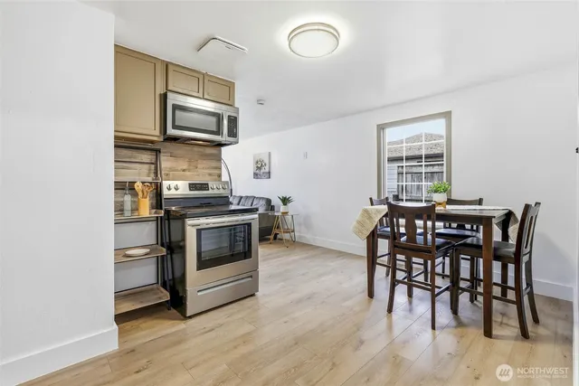 a kitchen with a stove and a microwave