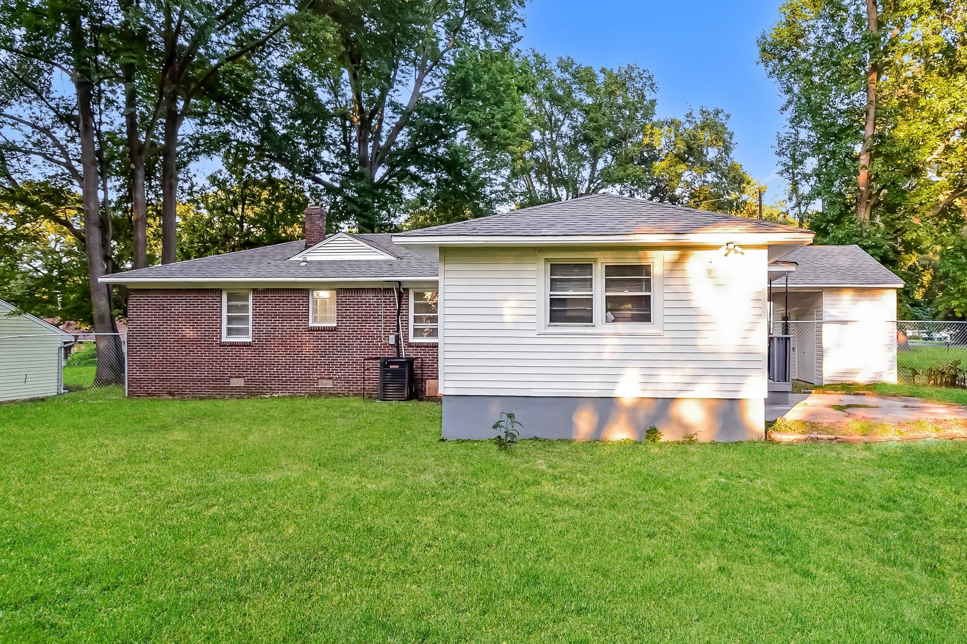 5041 Davis Cove Memphis, TN 38116 - Photo 15 of 16 a front view of a house with a garden