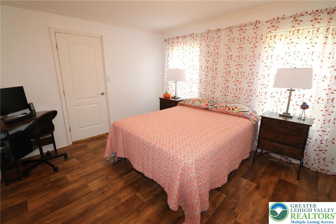 5005 Old Timber Road Stroudsburg, PA 18360 - Photo 20 of 44 a bedroom with a bed and wooden floor