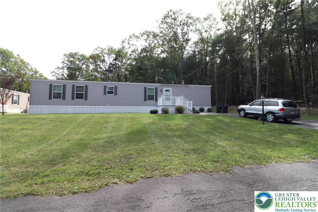 5005 Old Timber Road Stroudsburg, PA 18360 - Photo 2 of 44 a front view of a house with garden