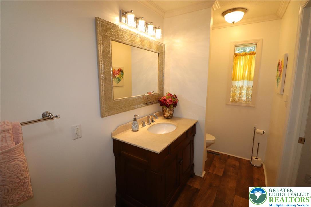5005 Old Timber Road Stroudsburg, PA 18360 - Photo 25 of 44 a bathroom with a sink vanity granite and a mirror