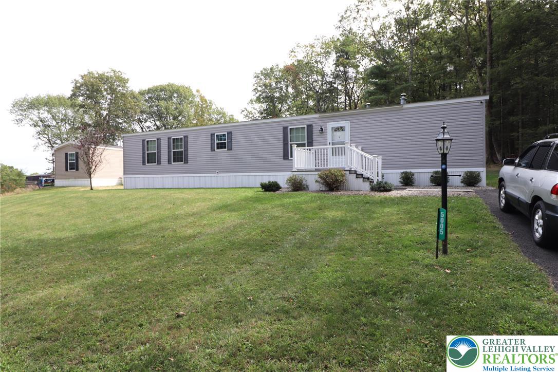 5005 Old Timber Road Stroudsburg, PA 18360 - Photo 27 of 44 a view of a yard in front of a house with large tree