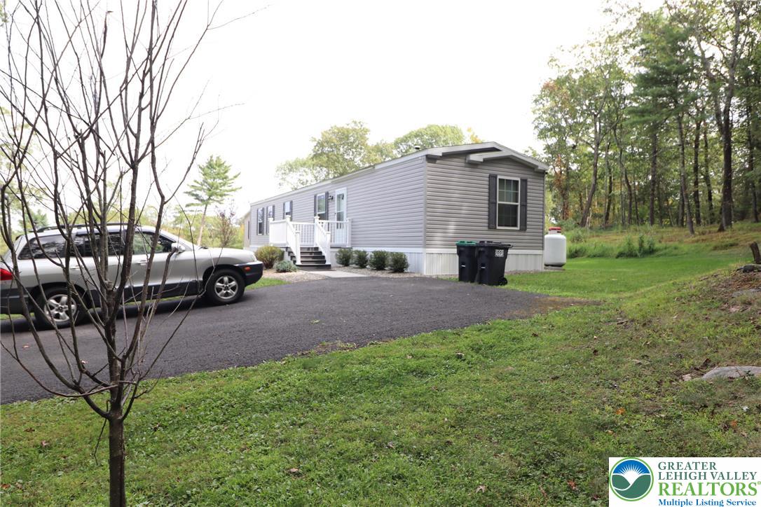 5005 Old Timber Road Stroudsburg, PA 18360 - Photo 30 of 44 a view of a house with a yard