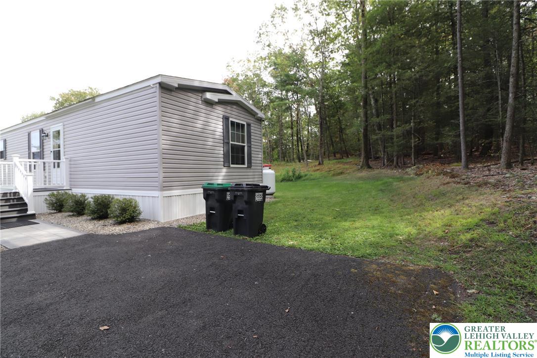 5005 Old Timber Road Stroudsburg, PA 18360 - Photo 31 of 44 a view of a house with backyard porch and garden