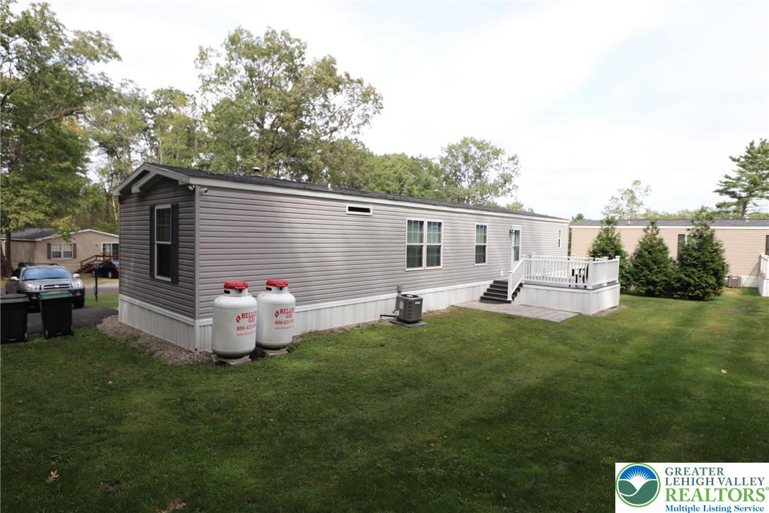 5005 Old Timber Road Stroudsburg, PA 18360 - Photo 32 of 44 a backyard of a house with table and chairs