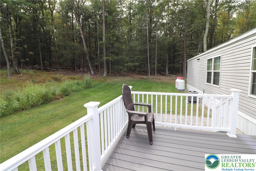 5005 Old Timber Road Stroudsburg, PA 18360 - Photo 38 of 44 a view of a wooden deck and a yard