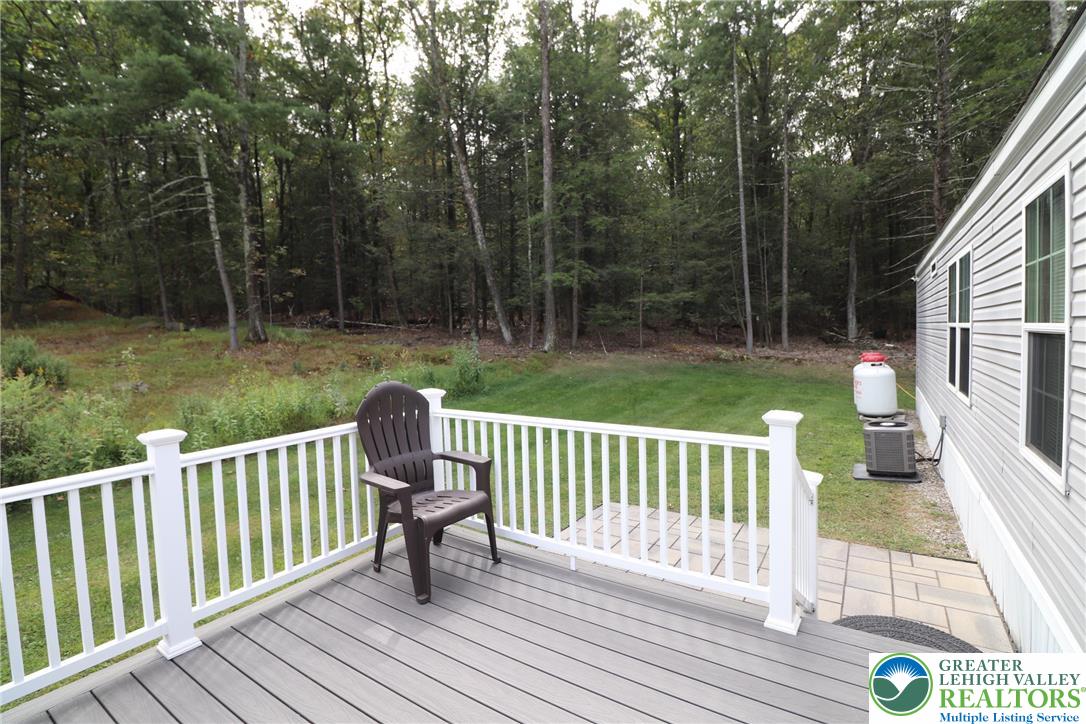 5005 Old Timber Road Stroudsburg, PA 18360 - Photo 39 of 44 a view of a deck with two chairs and a yard