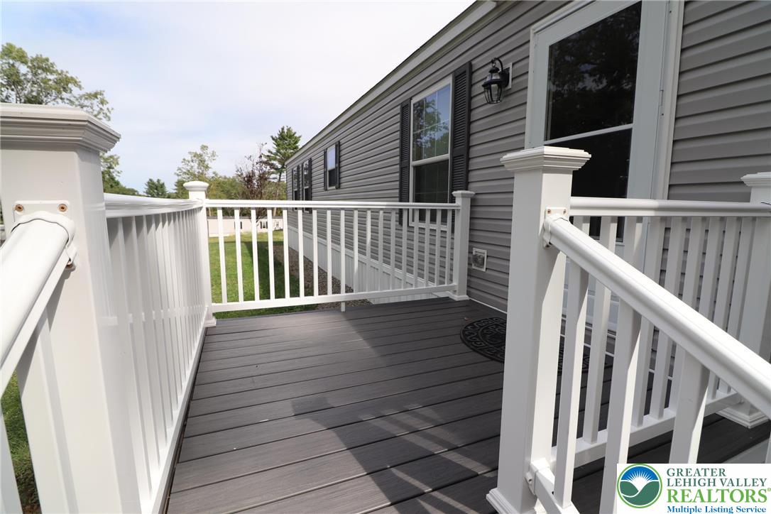5005 Old Timber Road Stroudsburg, PA 18360 - Photo 4 of 44 a view of a balcony with wooden floor and fence