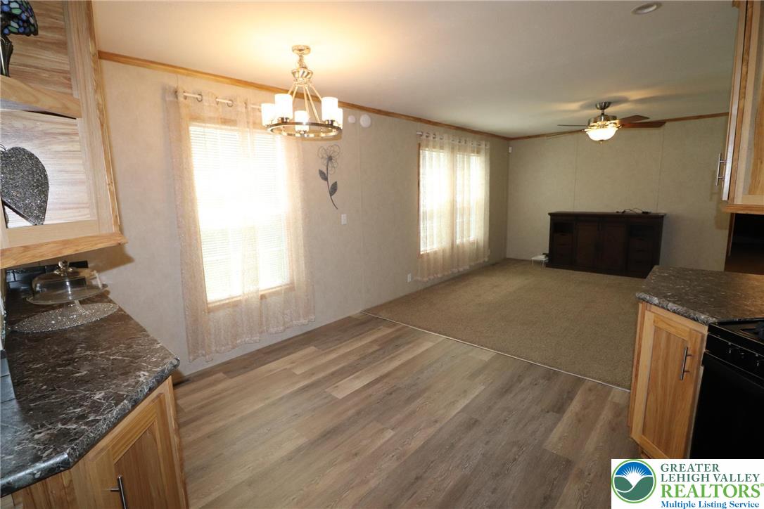 5005 Old Timber Road Stroudsburg, PA 18360 - Photo 6 of 44 a kitchen with kitchen island a counter top space appliances and a window