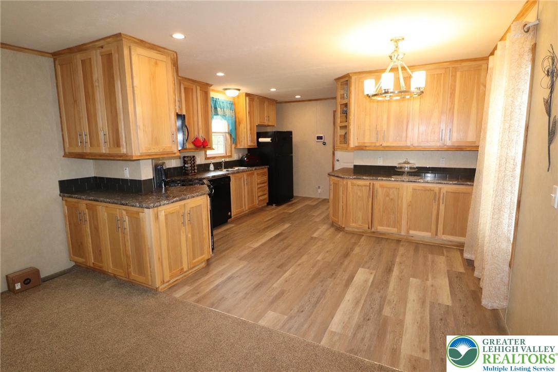 5005 Old Timber Road Stroudsburg, PA 18360 - Photo 8 of 44 a kitchen with stainless steel appliances granite countertop a stove a sink and a refrigerator