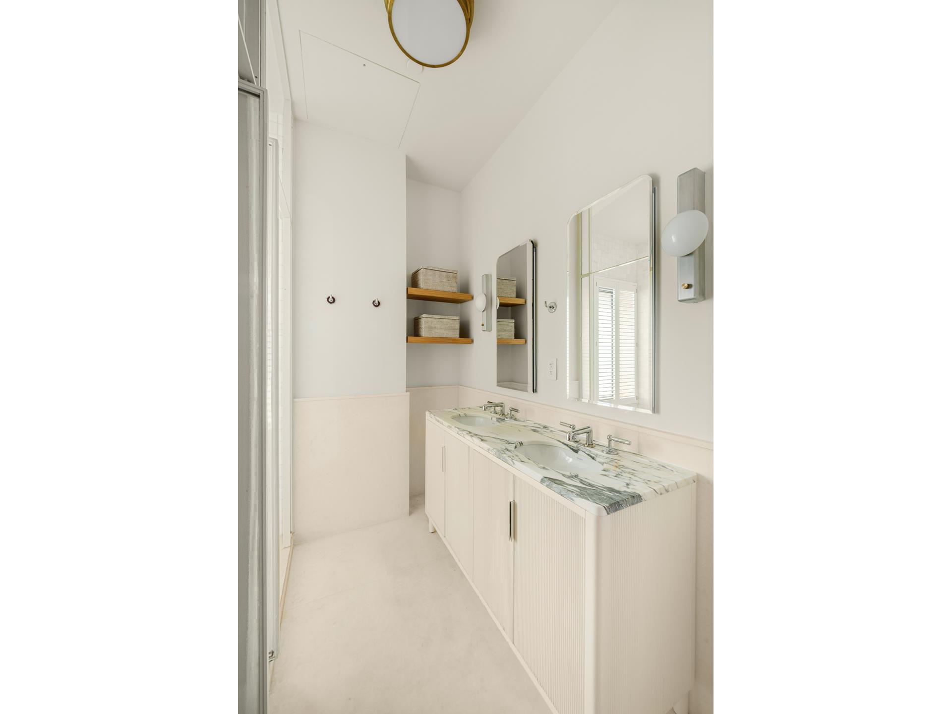 1 Prospect Park West, Unit PHF Brooklyn, NY 10035 - Photo 6 of 21 a bathroom with a granite countertop sink and a mirror