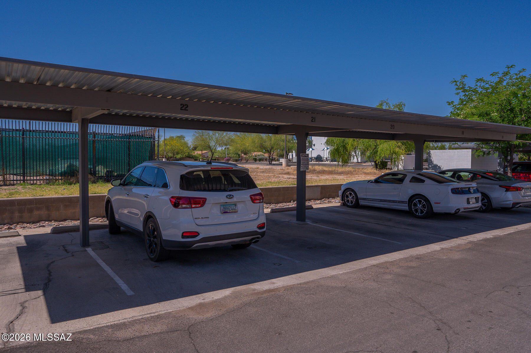 7777 East Golf Links Road, Unit 2308 Tucson, AZ 85730 - Photo 9 of 37 a car parked in front of a building