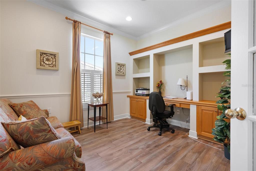 1807 San Trovaso Way Venice, FL 34285 - Photo 11 of 61 a view of workspace with wooden floor and windows