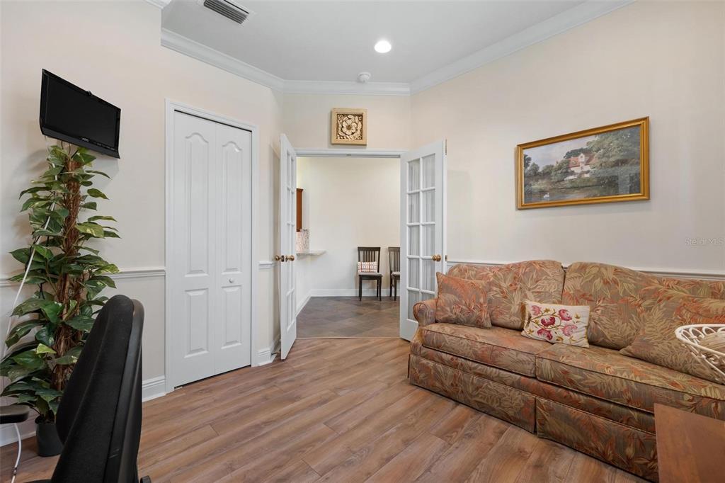 1807 San Trovaso Way Venice, FL 34285 - Photo 12 of 61 a living room with furniture and a potted plant