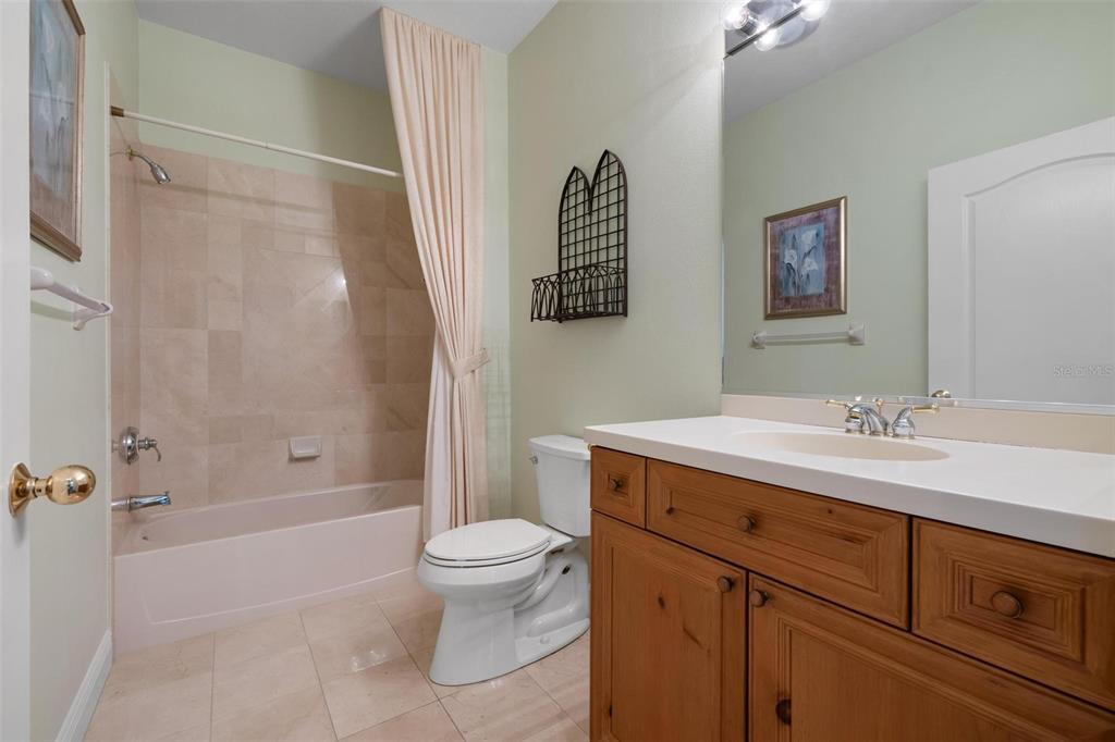 1807 San Trovaso Way Venice, FL 34285 - Photo 19 of 61 a bathroom with a sink a toilet and shower