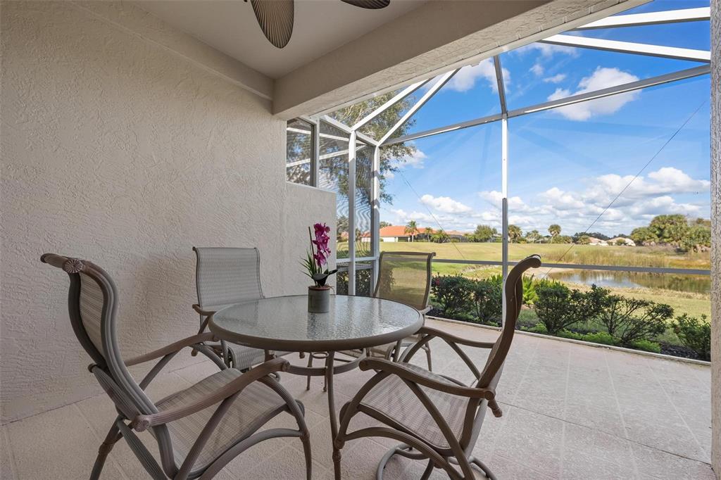 1807 San Trovaso Way Venice, FL 34285 - Photo 23 of 61 a dining room with furniture and a floor to ceiling window